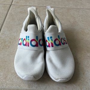 White slip on adidas sneakers